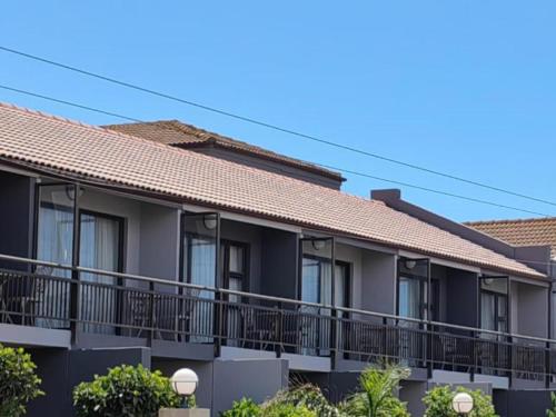 a row of apartment buildings with balconies at Sunset Lodge in St. Helena Bay
