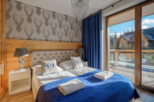 Postel nebo postele na pokoji v ubytování Aparthotel Góralski Spa & Restaurant