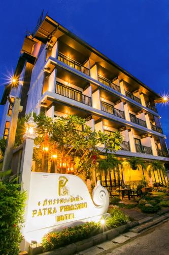 a hotel with a sign in front of it at Patra Phrasing Boutique Hotel in Chiang Mai