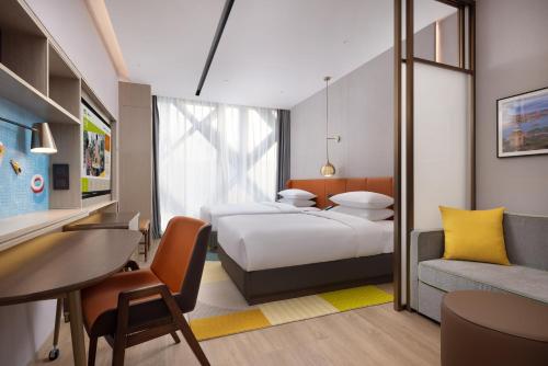Voodi või voodid majutusasutuse Home2 Suite by Hilton Chongqing Wanzhou toas