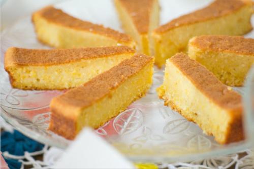 a glass plate with four pieces of cake on it at Sol Nascente Hotel Pousada Beira Mar in Natal