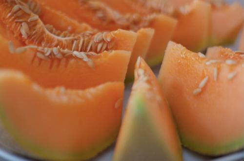 a close up of orange fruit on a plate at Sol Nascente Hotel Pousada Beira Mar in Natal