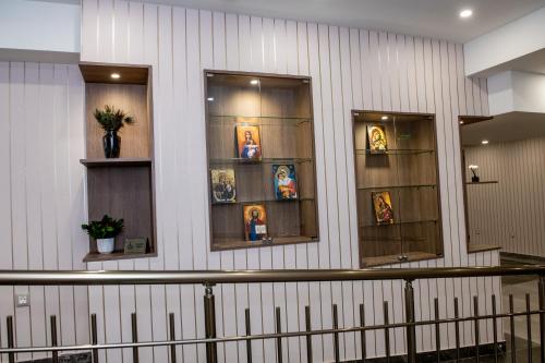 a building with three windows with pictures on it at BG Hotel in Sofia