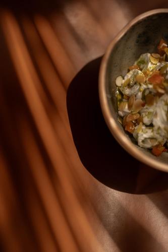 a bowl of food sitting on top of a table at @before sunset in Cesme