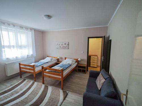 Postel nebo postele na pokoji v ubytování Corner Apartman