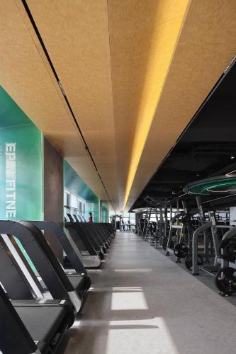 an empty gym with rows of chairs and a ceiling at Grand Mercure Shenzhen Guangming in Shenzhen