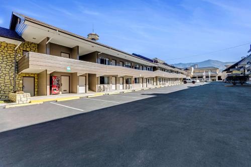 an empty parking lot in front of a building at The Wander Hotel in Gatlinburg