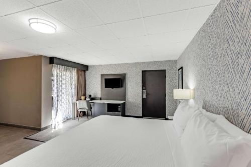 a hotel room with a bed and a desk at The Wander Hotel in Gatlinburg