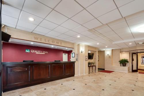a lobby with a welcome sign on a wall at Quality Inn in Baltimore