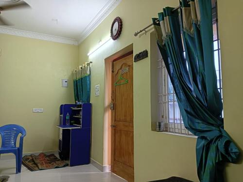 Kuchyň nebo kuchyňský kout v ubytování Lakshmi Ammal Guest House