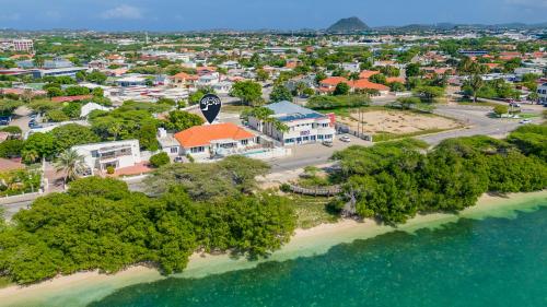 an aerial view of a resort on a beach at LUX 10BR 10BA Pool Beach Front Villa Playa by Bocobay in Oranjestad