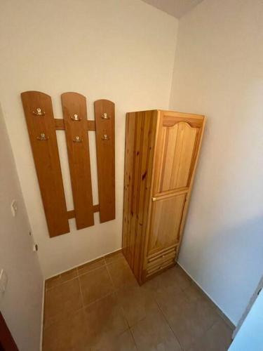 a small room with wooden panels and a door at FLORA Apartment Hotel 412 in Borovets