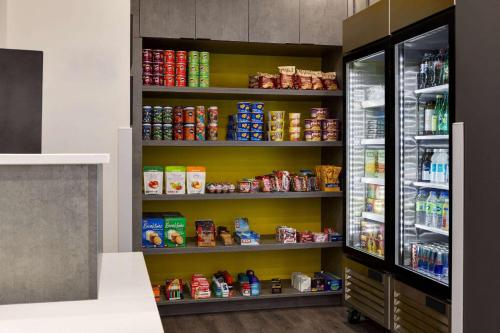 a pantry with shelves filled with food at Microtel Inn & Suites by Wyndham Boisbriand in Sainte-Thérèse-de-Blainville