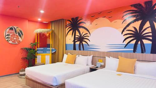 Postel nebo postele na pokoji v ubytování Yellow Bee Resort Cililitan