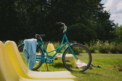 a blue bike is parked next to a chair at Hotel Sea Front in Tammisaari