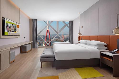 Katil atau katil-katil dalam bilik di Home2 Suite by Hilton Chongqing Wanzhou