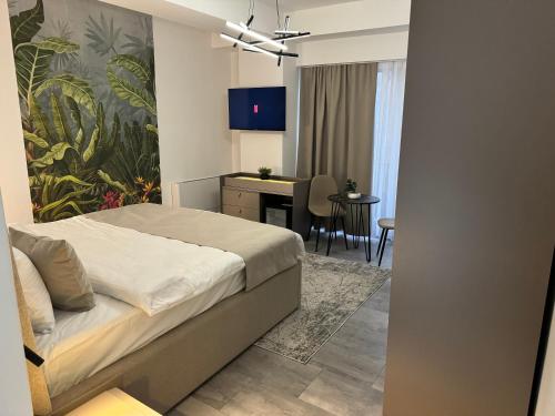 TV a/nebo společenská místnost v ubytování hotel le manoir