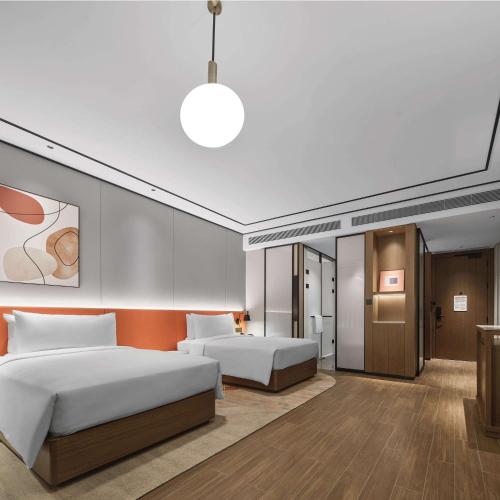 Ένα ή περισσότερα κρεβάτια σε δωμάτιο στο Hilton Garden Inn Beijing Yizhuang