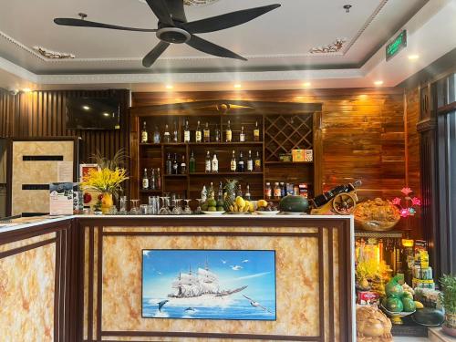 a bar with a picture of a ship at View Point - Anh Quan in Cat Ba