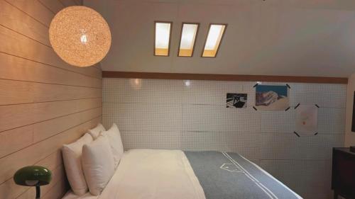 a bedroom with a bed in a room at Chill Roof Hotel in Taipei