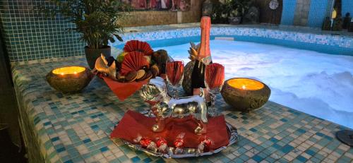 a statue of a horse next to a swimming pool at Janus Boutique Hotel & Spa in Siófok