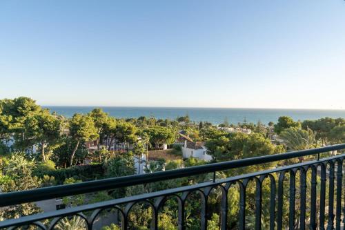a view of the ocean from a balcony at Kimpton Los Monteros Marbella by IHG in Marbella