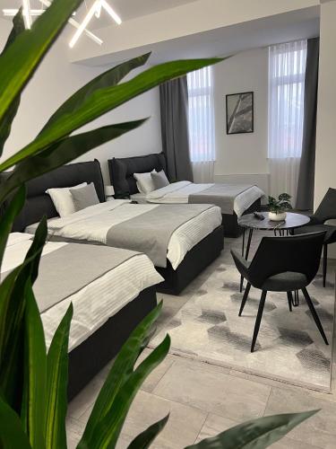 Postel nebo postele na pokoji v ubytování hotel le manoir