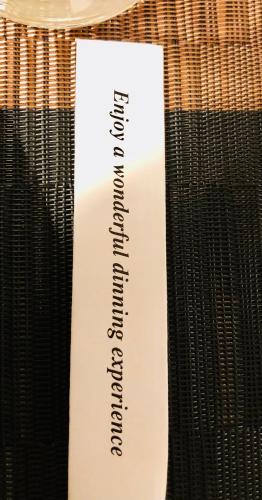a white piece of paper with writing on a table at de drie populieren in Losser