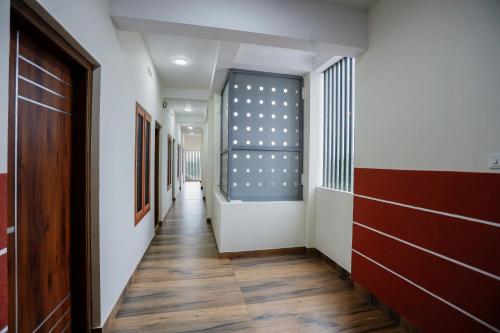 a corridor of a hallway with a hallway at Hotel Diamond Castle in Manjeri