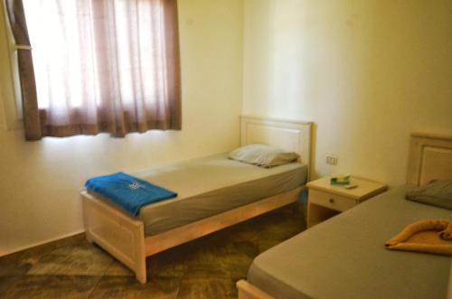 Una cama o camas en una habitación de Elite Residence Dahab