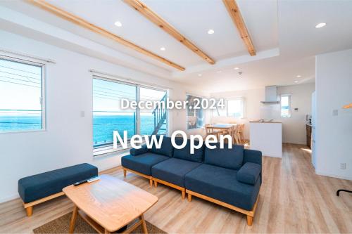 a new open living room with a couch and a table at Breeze Awaji Kamaguchi in Awaji