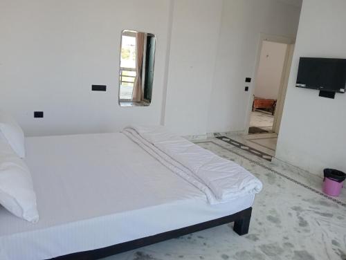 Ένα ή περισσότερα κρεβάτια σε δωμάτιο στο Bagol Niwas