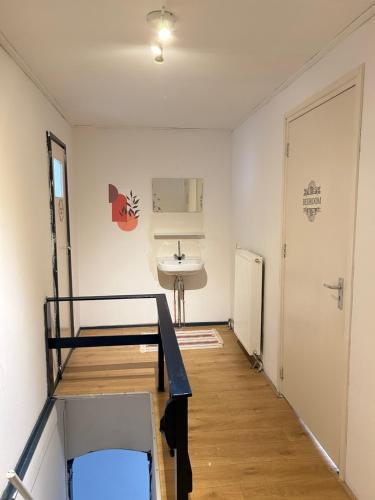 a room with a sink and a bed in it at Stay and Sleep in Leeuwarden