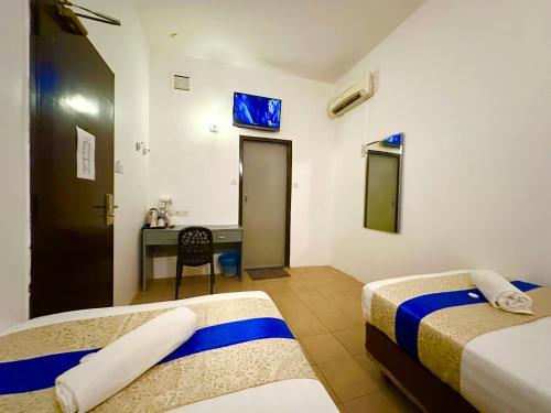 Ένα ή περισσότερα κρεβάτια σε δωμάτιο στο Park Hotel