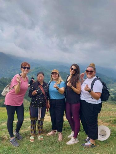 a group of women standing on top of a hill at Sapa Family Homestay in Sa Pa