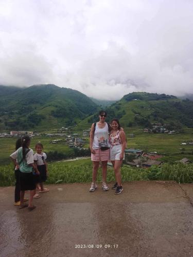 a group of women standing on top of a hill at Sapa Family Homestay in Sa Pa