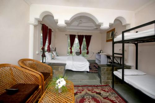 Ένα ή περισσότερα κρεβάτια σε δωμάτιο στο Tribal Wood Resort