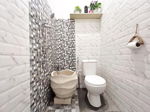 Ένα μπάνιο στο Rumah Boho