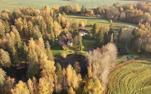 an aerial view of a house in a forest at Peetri mõis & spa in Turva