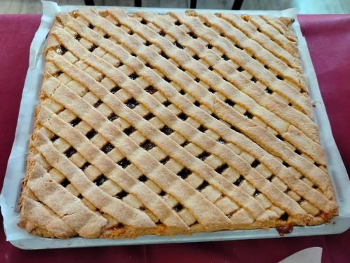a lattice pie on a plate on a table at Hotel Sporting in Casarsa della Delizia