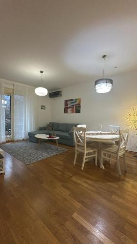 a living room with a table and a couch at Posto Capitano apartment Sasa in Kotor