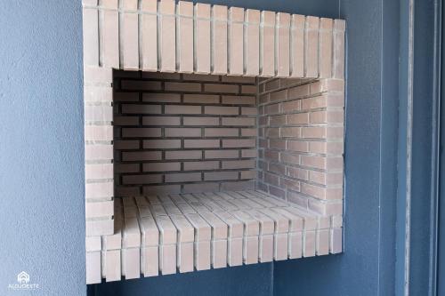 a brick fireplace is made out of legos at Varanda do Guincho - Classy Apt in Santa Cruz in Silveira