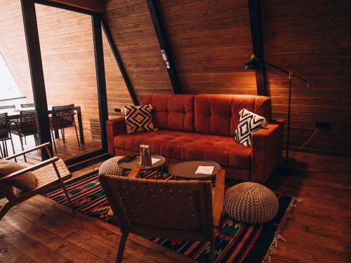 a living room with a couch and a table at УЛІС Ворохта in Ilʼtsya Gurny