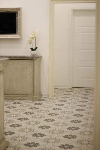 a room with a door and a carpet at PLAZA Boutique Hotel - Tropea in Tropea