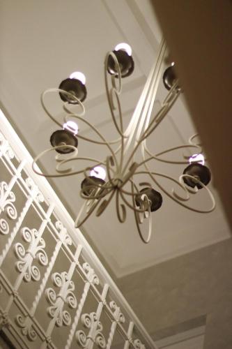 a chandelier is hanging from a ceiling at PLAZA Boutique Hotel - Tropea in Tropea