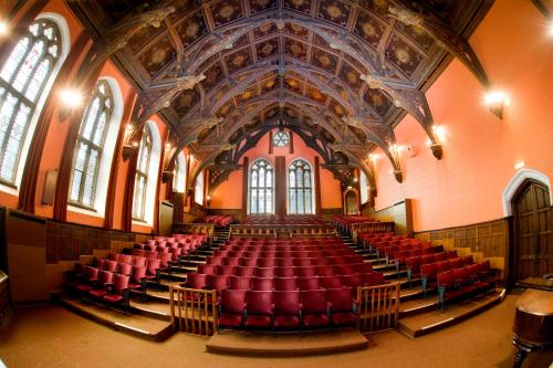 an empty auditorium with red seats in a building at Ushaw Historic House, Chapels & Gardens in Durham