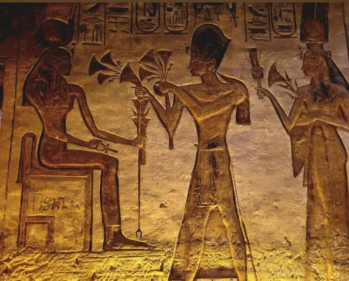 a painting of two women on a wall at Osiris Guest House in Abu Simbel
