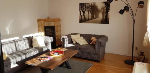 a living room with a couch and a coffee table at Ferien Gnevkow 45 - Mit dem Zug direkt ins Grüne - Entspannung inklusive in Gnevkow