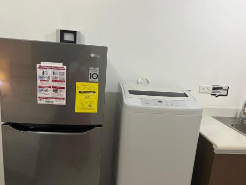 a machine in a kitchen next to a counter at Beachfront U.S. Embassy Family Retreat. in Manila