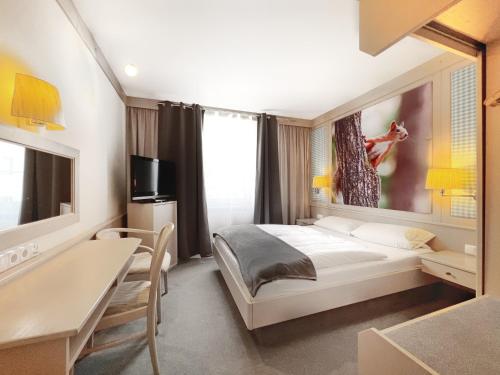 Postel nebo postele na pokoji v ubytování WAGNERS Hotel Schönblick, C&C Hotels und Vertrieb GmbH
